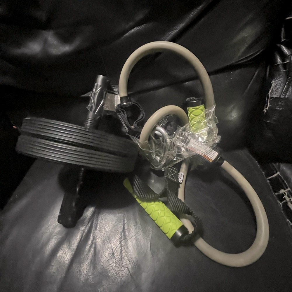 Exercise bundle. Push up wheel and stretch cables.